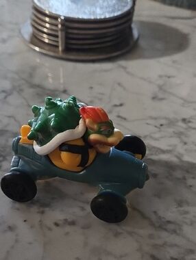 Green-Shelled Character Kart Toy in Teal and Yellow